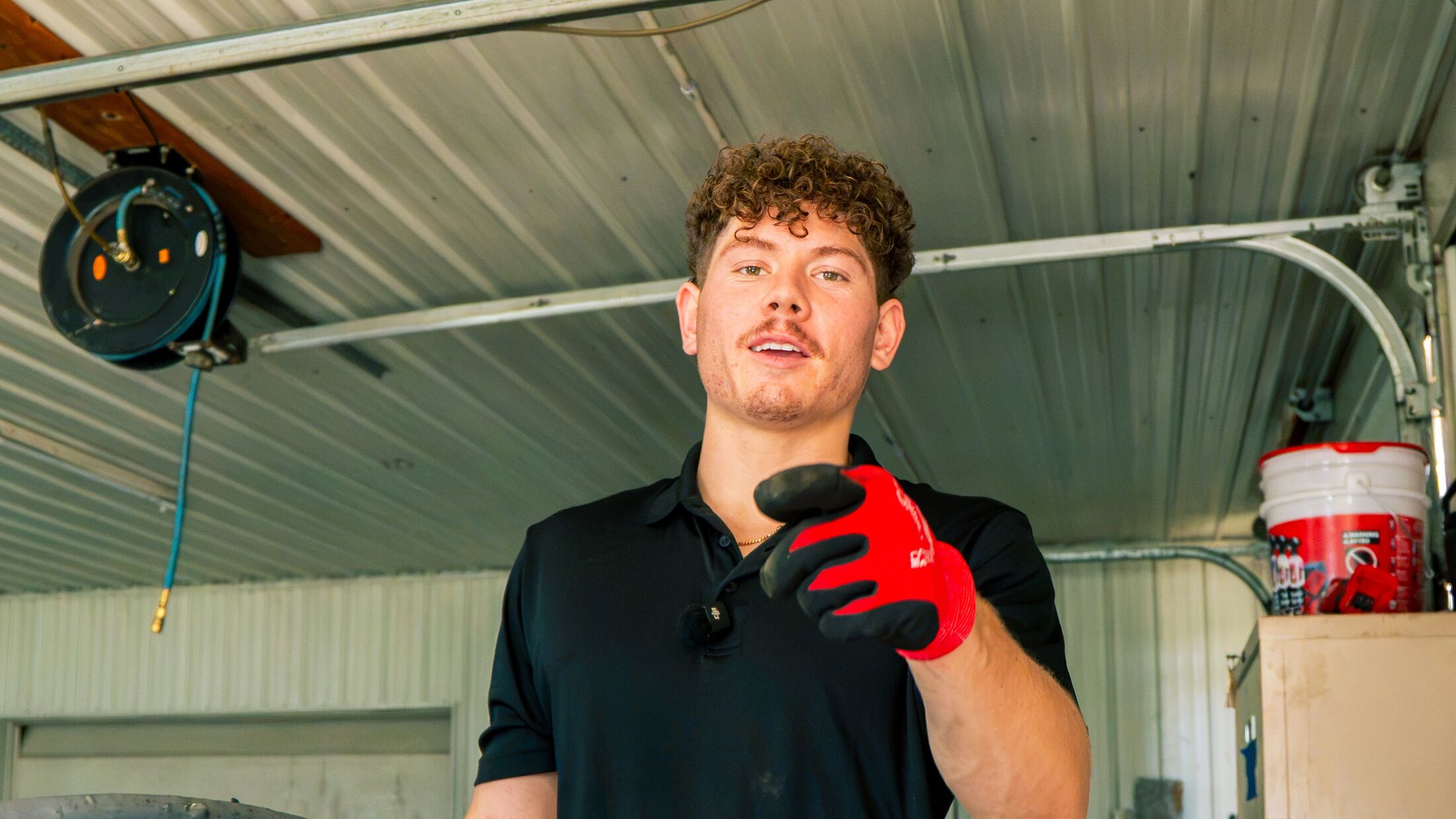 An Elevation technician at a customer's garage door before starting the work